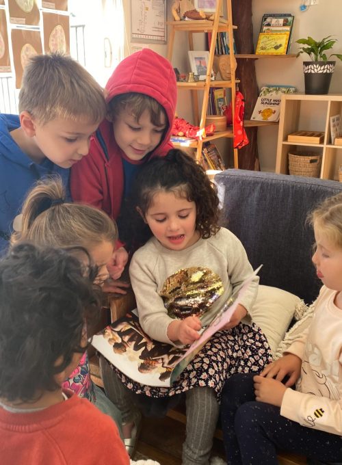 Children engaged in a learning activity at Alfred Academy