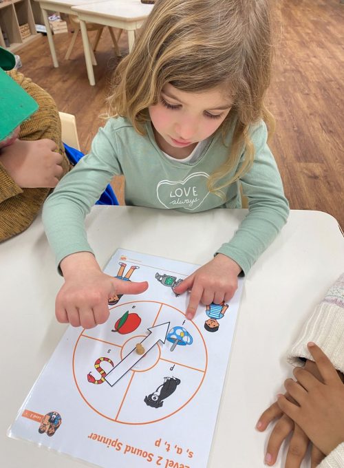 Child taking part in school readiness activities